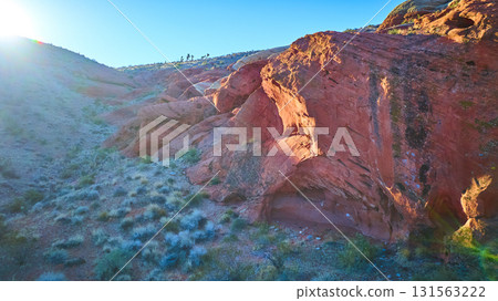 Aerial Red Rock Formations and Sunlit Desert Landscape at Golden Hour 131563222