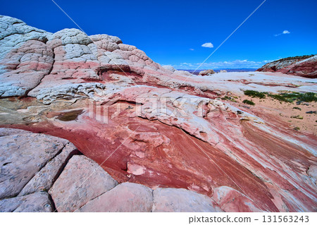 Swirling Multicolored Sandstone and Domes in White Pocket Arizona under Blue Sky Swirling Multicolored Sandstone and Domes in White Pocket Arizona under Blue Sky 131563243