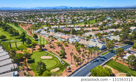 Aerial Las Vegas Residential Golf Course Community With Distant Strip Skyline 131563313