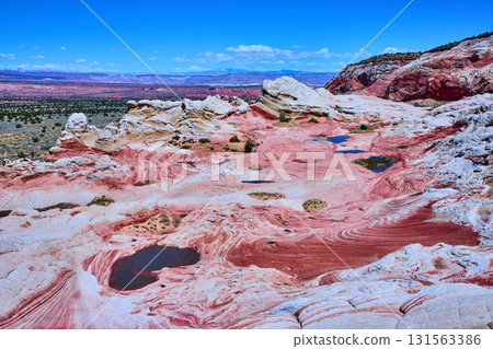 Colorful Swirling Sandstone and Pools at White Pocket Arizona Desert Landscape Colorful Swirling Sandstone and Pools at White Pocket Arizona Desert Landscape 131563386