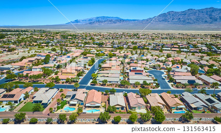 Aerial Residential Neighborhood and Suburban Homes Las Vegas with Desert Mountain Backdrop Aerial Residential Neighborhood and Suburban Homes Las Vegas with Desert Mountain Backdrop 131563415