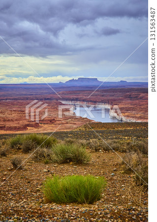 Lake Powell Red Rock Canyon and Desert Terrain under Moody Sky 131563487