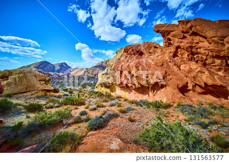 Red Sandstone Formations and Desert Landscape under Blue Sky in Nevada Red Sandstone Formations and Desert Landscape under Blue Sky in Nevada 131563577