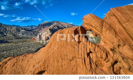 Aerial Red Sandstone Arch Formation and Desert Landscape Nevada 131563604
