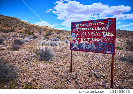 Weathered Desert Sign with Bullet Holes and Graffiti in Nevada Wilderness Weathered Desert Sign with Bullet Holes and Graffiti in Nevada Wilderness 131563626