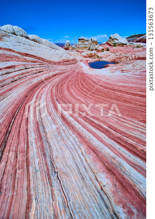 Swirling Sandstone Striations and Reflective Pool White Pocket Arizona Wide Angle 131563673