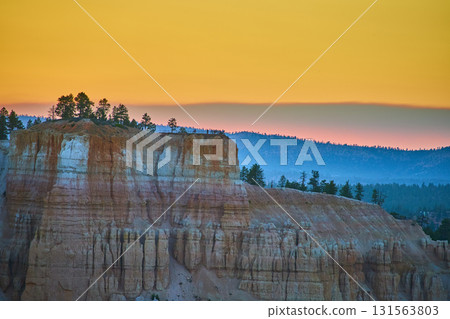 Bryce Point Hoodoos and Pines at Sunset in Bryce Canyon National Park Bryce Point Hoodoos and Pines at Sunset in Bryce Canyon National Park 131563803