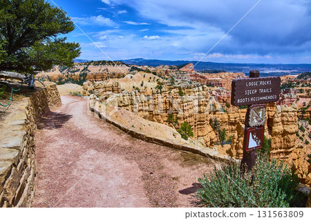 Bryce Canyon National Park Trail Sign and Hoodoo Rock Formations under Blue Sky Bryce Canyon National Park Trail Sign and Hoodoo Rock Formations under Blue Sky 131563809