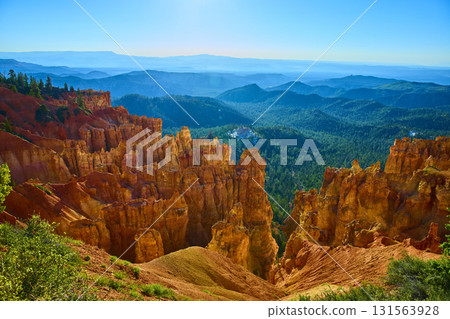 Bryce Canyon Hoodoos Overlook with Pine Forest and Blue Mountain Ridges 131563928