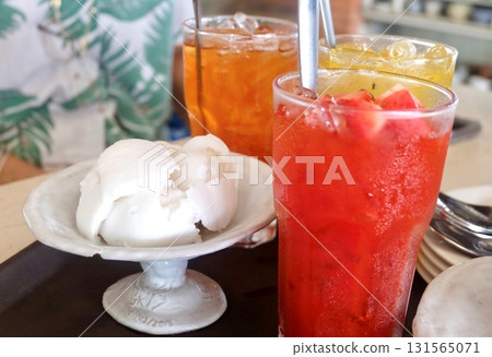 Coconut Ice Cream with Tropical Punch Beverage 131565071