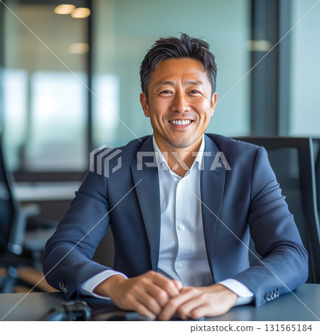 A man with a calm expression reminiscent of a director or CEO 131565184