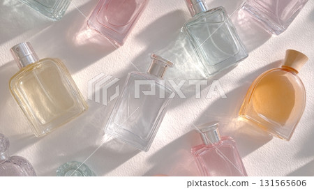 Flat lay of various perfume bottles highlights diverse fragrances for self-care and aromatic experiences Flat lay of various perfume bottles highlights diverse fragrances for self-care and aromatic experiences 131565606