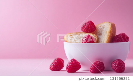 Raspberry fresh organic fruit and bread slice on ceramic white bowl pink backgroun 131566221