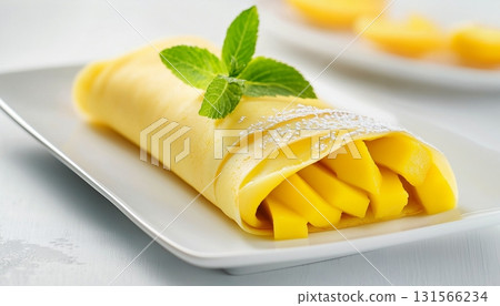 Mango crepe roll fresh organic fruit wrap by flat bread for simple dessert or breakfast on white plate Mango crepe roll fresh organic fruit wrap by flat bread for simple dessert or breakfast on white plate 131566234