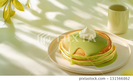 Sweet pancake with matcha cream topping on plate for simple breakfast Sweet pancake with matcha cream topping on plate for simple breakfast 131566862