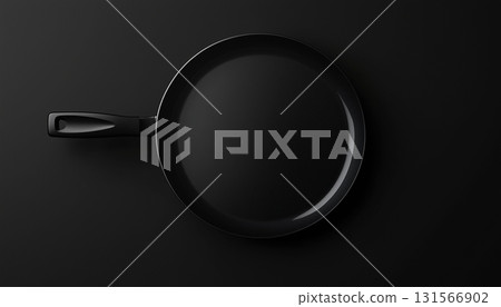Black iron frying pan flat lay on dark background 131566902