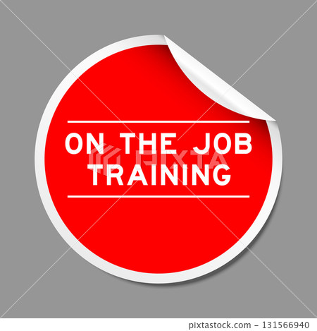 Red color peel sticker label with word on the job training on gray background Red color peel sticker label with word on the job training on gray background 131566940