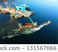 Aerial view of a barge and tugboat heading to a construction site at Hakodate Port in Hakodate, Hokkaido in autumn 131567066