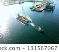 Aerial view of a barge and tugboat heading to a construction site at Hakodate Port in Hakodate, Hokkaido in autumn 131567067