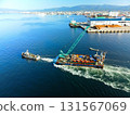 Aerial view of a barge and tugboat heading to a construction site at Hakodate Port in Hakodate, Hokkaido in autumn 131567069