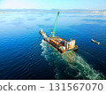 Aerial view of a barge and tugboat heading to a construction site at Hakodate Port in Hakodate, Hokkaido in autumn 131567070