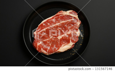 Beef slice on black pan plate for cooking dinner 131567146