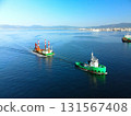 Aerial view of a barge and tugboat returning from a construction site at Hakodate Port in Hakodate, Hokkaido in autumn 131567408