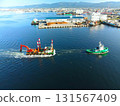 Aerial view of a barge and tugboat returning from a construction site at Hakodate Port in Hakodate, Hokkaido in autumn 131567409
