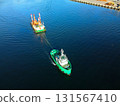 Aerial view of a barge and tugboat returning from a construction site at Hakodate Port in Hakodate, Hokkaido in autumn 131567410
