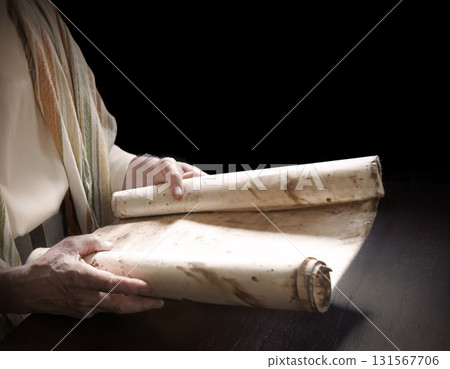 Man's hans holding a scroll 131567706