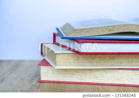 Close up of stake of books with customizable space for text. Personal Growth concept. 131568248