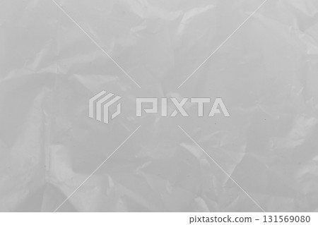 Close-up of transparent plastic texture with wrinkles clear background and crumpled surface detail 131569080