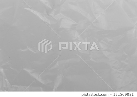 Close-up of transparent plastic texture with wrinkles clear background and crumpled surface detail Close-up of transparent plastic texture with wrinkles clear background and crumpled surface detail 131569081