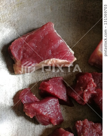 Raw beef steak meat. Delicious mixed Kobe and wagyu beef meat pieces to make famous recipe like barbeque, picanha, bourguignon, goulash, gourmet, stroganoff, ragout etc 131569703