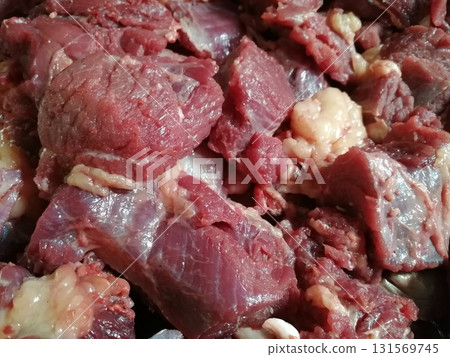 Raw beef steak meat. Delicious mixed Kobe and wagyu beef meat pieces to make famous recipe like barbeque, picanha, bourguignon, goulash, gourmet, stroganoff, ragout etc 131569745