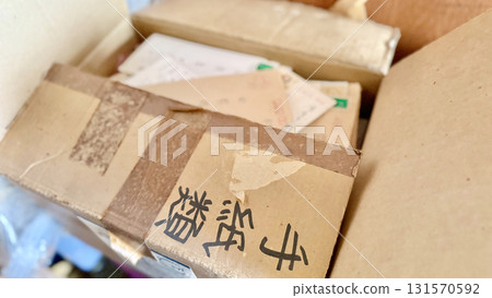 A half-open cardboard box with the word "letters" written on the lid 131570592
