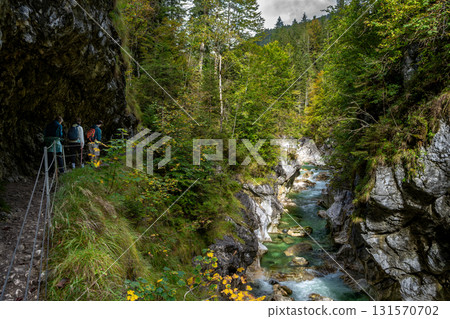 Hiking Group On Spectacular Trail Triftsteig Through Canyon Kaiserklamm With Brandenburger Ache In Tyrol, Austria 131570702