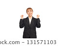 A woman in a business suit gives a thumbs up 131571103