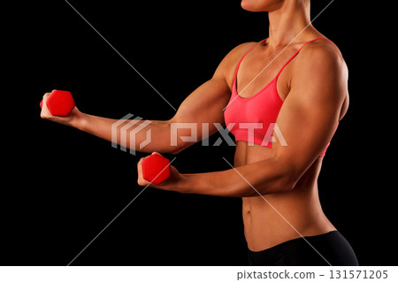 Sporty young woman with dumbbells isolated on black background, closeup shot 131571205