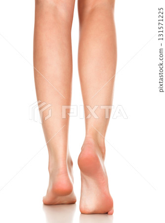 Closeup shot of female bare feet, isolated on white background 131571225