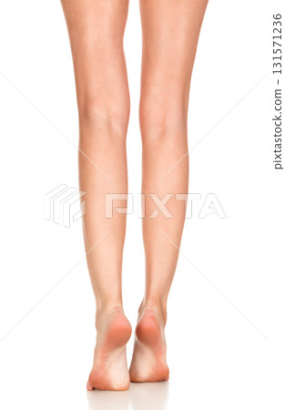 Closeup shot of female bare feet, isolated on white background 131571236