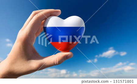 Hand holding a Russian flag heart and blue sky 131571801
