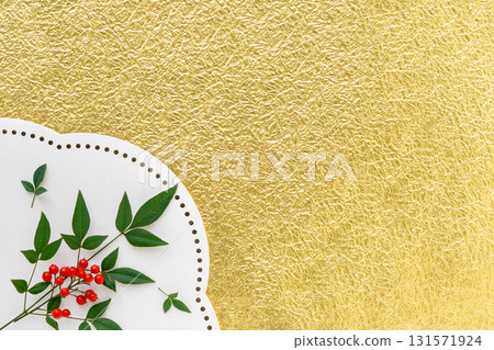 Background of nandina leaves and red berries on gold fir Japanese paper 131571924