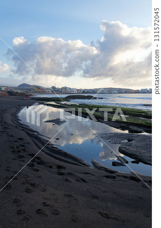 Breathtaking sunrise on beach in Canary Islands, sunny cloudy blue sky with copy space, El Medano, Tenerife Breathtaking sunrise on beach in Canary Islands, sunny cloudy blue sky with copy space, El Medano, Tenerife 131572045