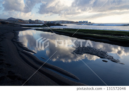 Breathtaking sunrise on beach in Canary Islands, sunny cloudy blue sky with copy space, El Medano, Tenerife 131572046
