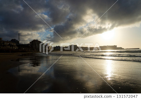 Breathtaking sunrise on beach in Canary Islands, sunny cloudy blue sky with copy space, El Medano, Tenerife Breathtaking sunrise on beach in Canary Islands, sunny cloudy blue sky with copy space, El Medano, Tenerife 131572047