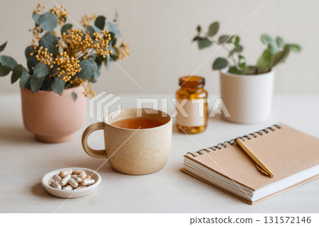 Omega-3 Capsules with Notebook and Cup of Tea 131572146