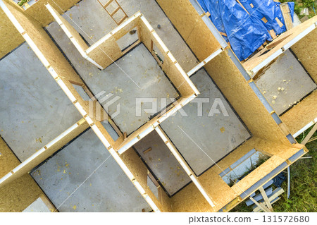 Construction of new and modern modular house. Walls made from composite wooden sip panels with styrofoam insulation inside. Building new frame of energy efficient home concept. 131572680