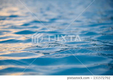 Closeup seascape surface of blue sea water with small ripple waves. Closeup seascape surface of blue sea water with small ripple waves. 131572702