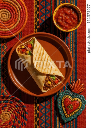 Mexican Burrito with Beef, Corn, and Salsa on Rustic Table 131573977